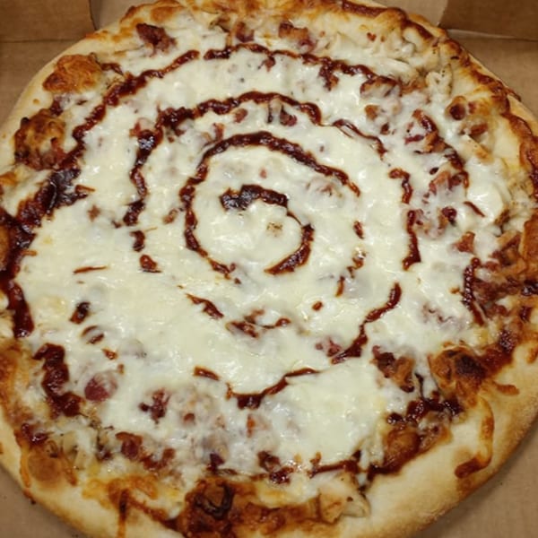 Venice Pizza's BBQ chicken pizza with a swirl of barbecue sauce over melted mozzarella cheese.